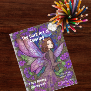 A Dark Fantasy Coloring Book on a wooden surface with a cup of colored pencils